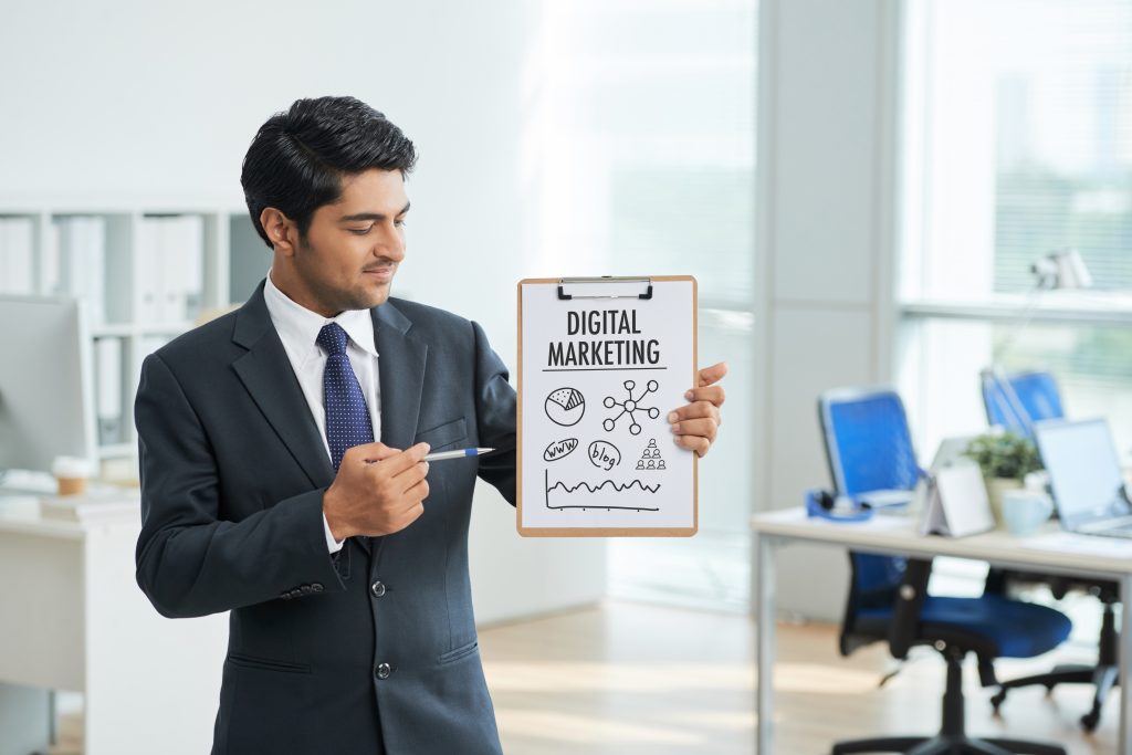 "person standing with digital marketing board"
